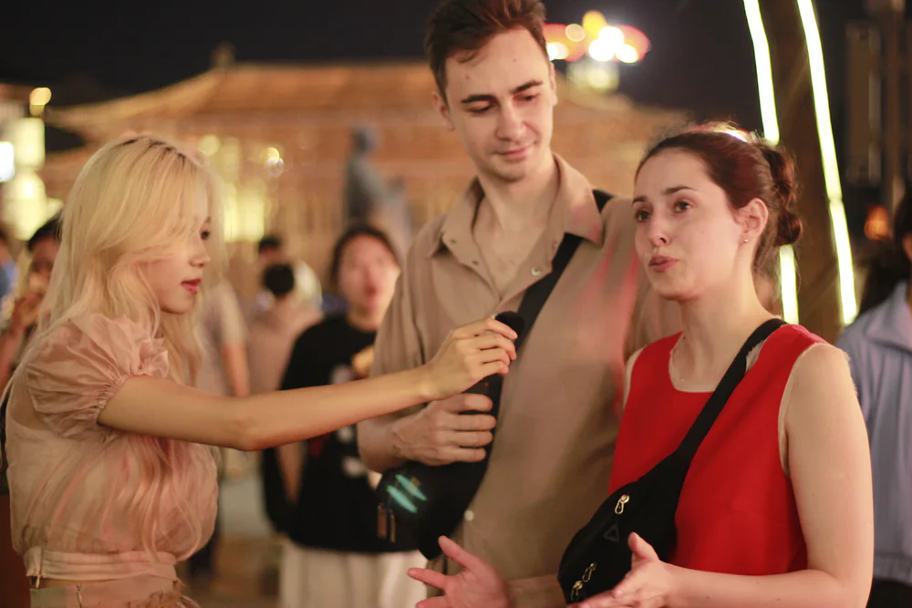 Travelers sharing a story during an evening encounter