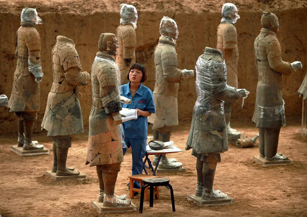 A conservator restoring the Terracotta Warriors